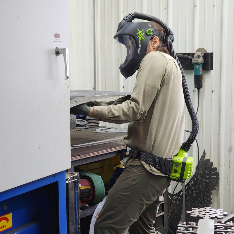 Person using a EZ Sander inside a workshop